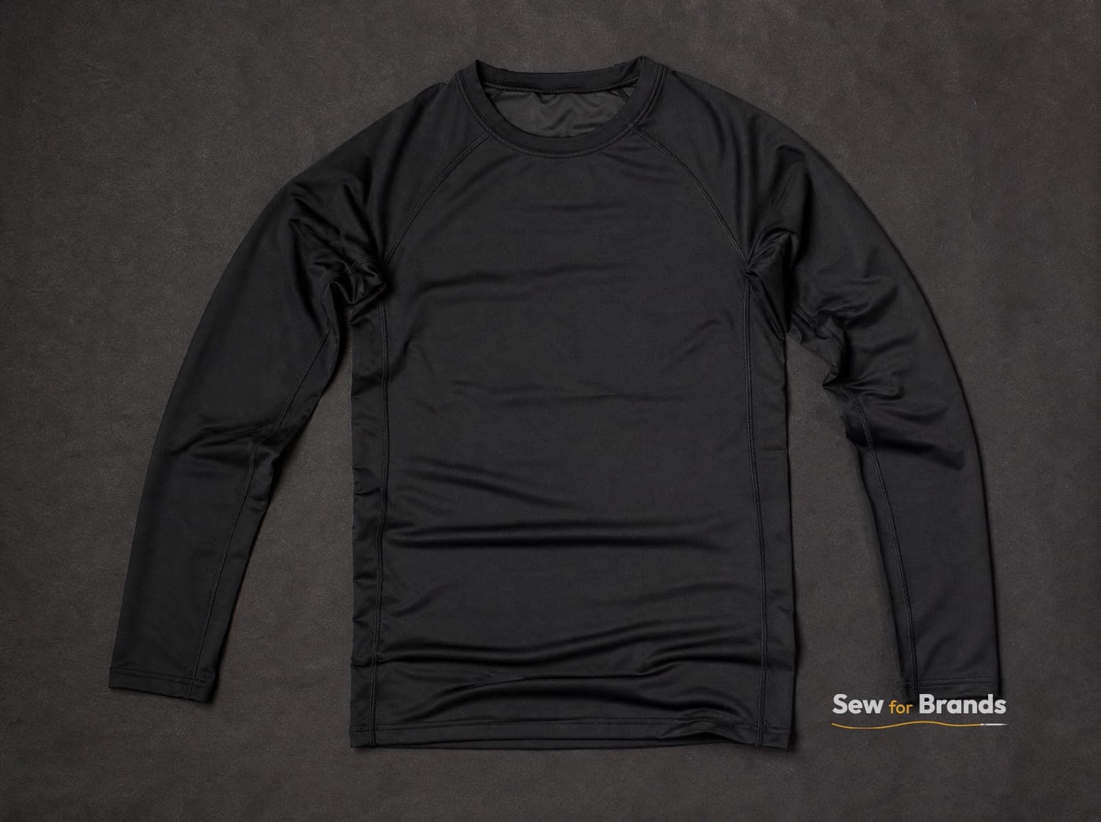 Black long-sleeve compression rash guard, front view