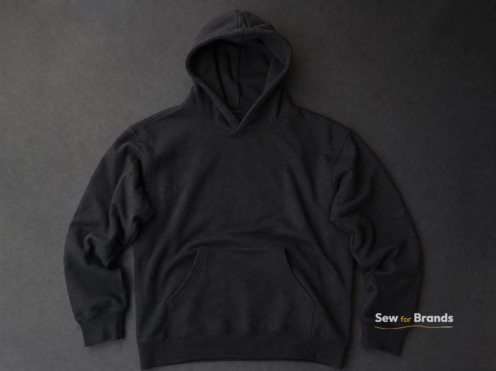 Heavyweight black pullover hoodie, front view, kangaroo pocket