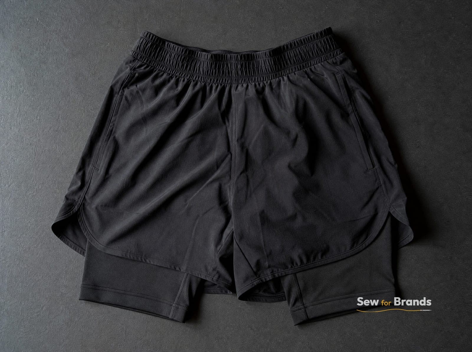 Black 2-in-1 running shorts with inner liner